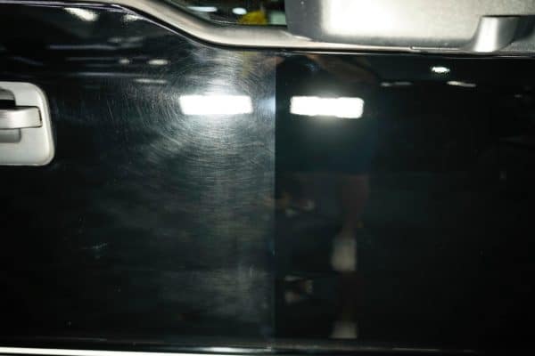 Before And After Paint Correction Services On Black Vehicle