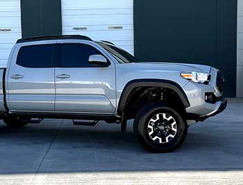 Clear Bra/PPF Installation Specialists On A Toyota Tacoma