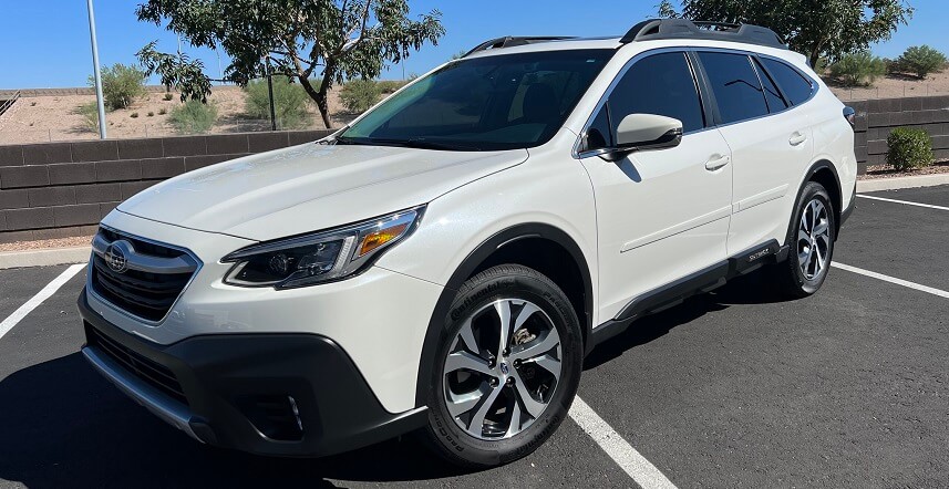White Subaru Outback SUV With Custom Aftermarket Detail Package
