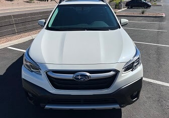 Hard Water Stain Removal And Ceramic Coating On White Subaru Outback SUV