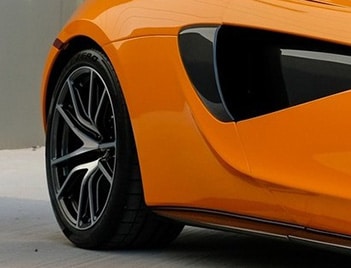 Quality Vinyl Wrapping Service On Orange McLaren 540C Luxury Car