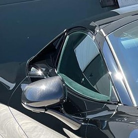 Correction Package On A Black McLaren 720S Sports Car