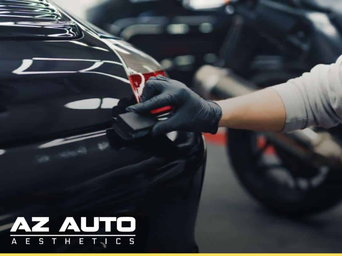 Applying Ceramic Coatings to a car's surface at AZ Auto Aesthetics.