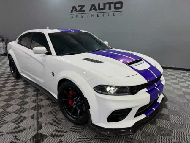 😈Power Up Front. Protection All Around.🛡️

This 2022 Dodge Charger came in for a full treatment focused on both protection and presence. We started with a paint correction to clean up the factory finish, followed by @feynlab Ceramic Ultra V2 to lock in gloss, depth, and long-term protection.

From there, we added our Full-Front Coverage Option using @xpel Ultimate Plus Paint Protection Film, along with optional protection for the A-pillars, roofline, door cups, sills, rear rock guards, and splitter—covering the high-impact areas that see real wear.

To finish it off, we installed a custom dual purple vinyl stripe for a bold, personal touch and applied our 5-Window + Windshield Ceramic Tint using @xpel XR Prime Plus for heat rejection, UV protection, and daily comfort.

The result: aggressive looks, thoughtful protection, and a Charger that’s built to be driven without showing daily imperfections. 

Looking to protect and personalize your vehicle the right way?

📞📲 Call or DM us today to book your Paint Protection Film, Ceramic Coating, Tint, or Custom Vinyl! 📞📲

Az Auto Aesthetics
7613 E Ray Rd #114, Mesa, AZ 85212
Open: M–F 8:30–6 PM | Sat 9–2 PM
https://wedetailaz.com
📞 (480) 241-9324

#charger #xpel #feynlab #ppf